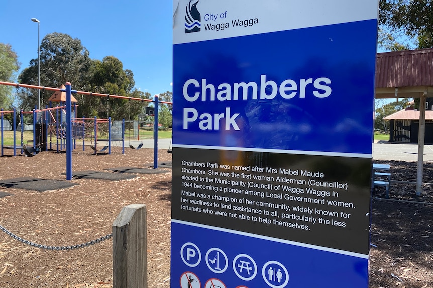 Chambers Park sign in front of a playground.