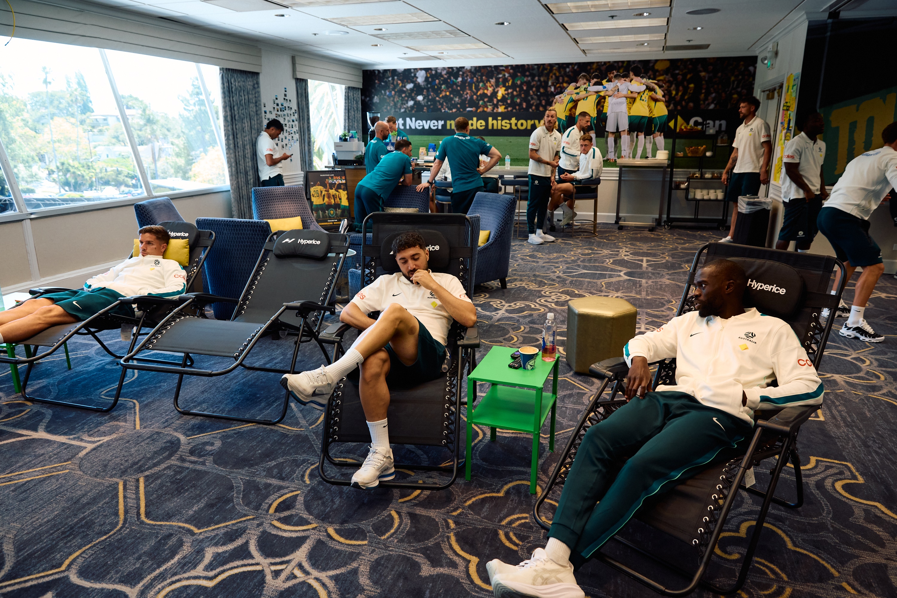 Socceroos players relax in the recreation room at the Claremont Country Club