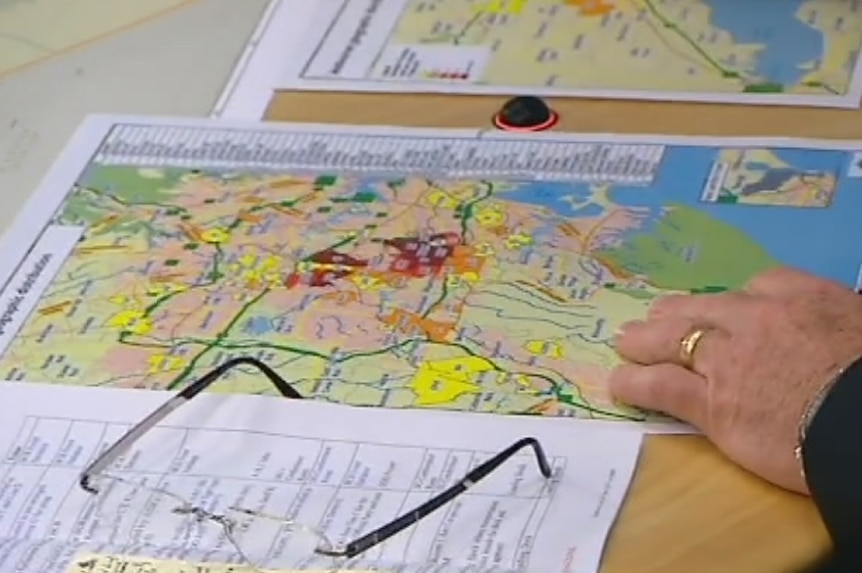 Map showing top terrorist recruitment suburbs on table