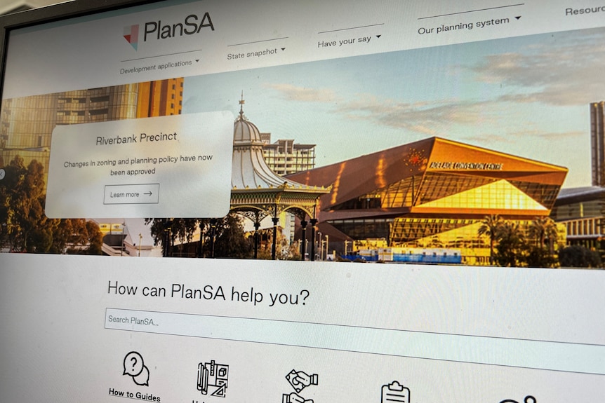A photograph of the PlanSA website on a computer screen.