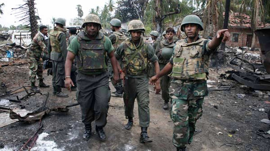 Government soldiers inspect the area inside the civil war zone in May 2009.