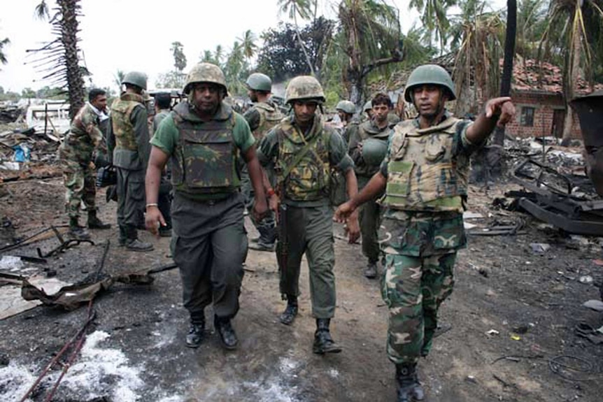 Government soldiers inspect the area inside the civil war zone in May 2009.
