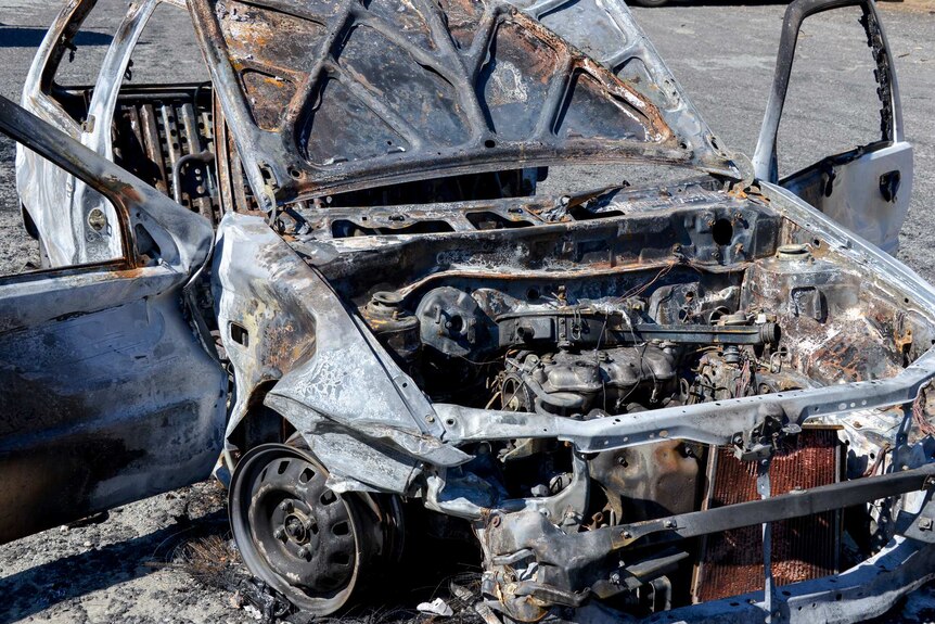 A burnt-out car near Kambah Pools.
