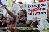 People protest the death penalty outside a Texas prison