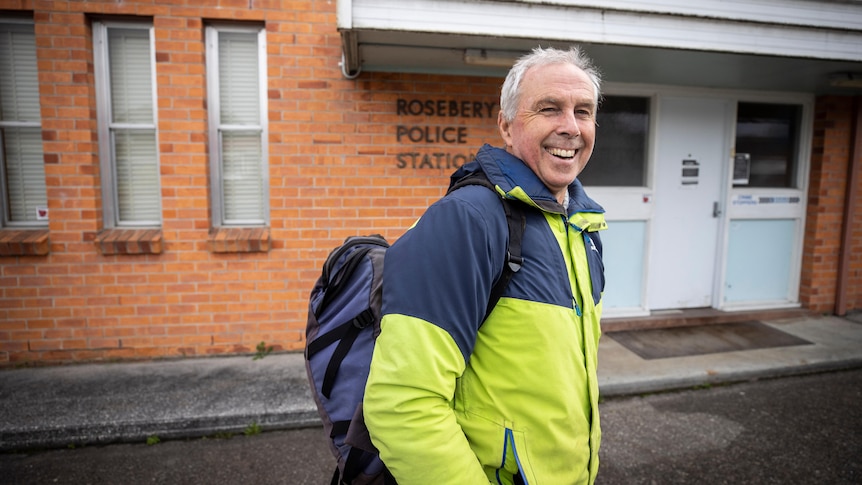 A man outside a police station.