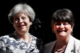 Theresa May poses for a photograph with Arlene Foster.