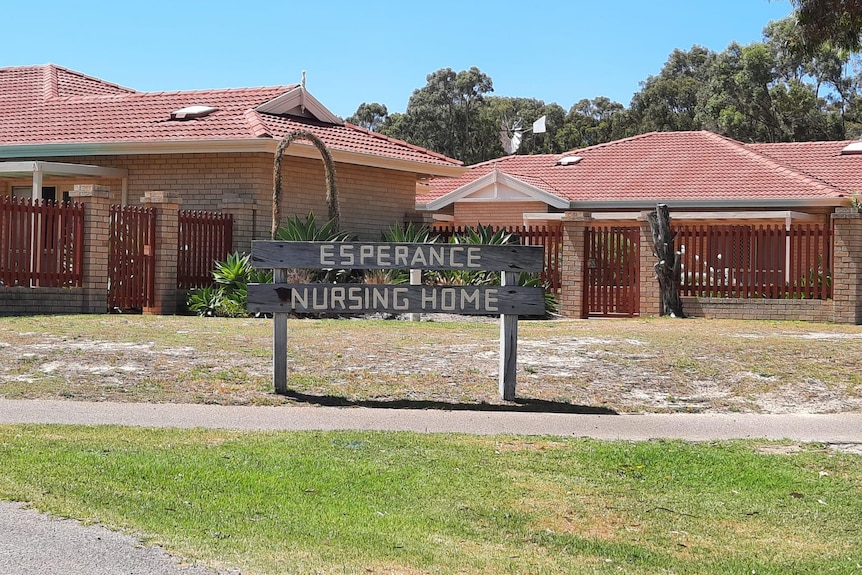 A wooden sign says 'Esperance Nursing Home' 