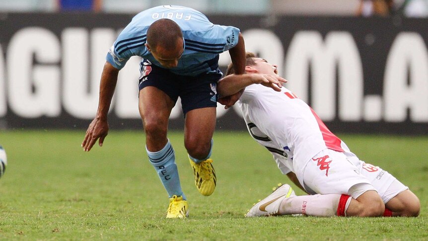 Sydney FC's Fabio (L) will receive no sanction for his tackle from behind on the Heart's Ben Garuccio.