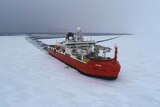 Aerial view of a ship cutting a path through ice  towards the camera.
