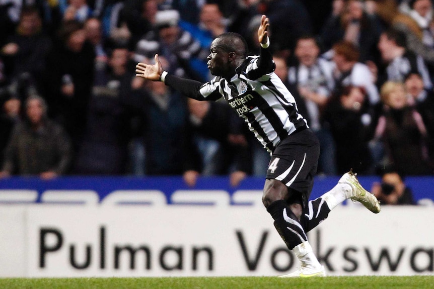 Cheick Tiote celebrates a goal against Arsenal