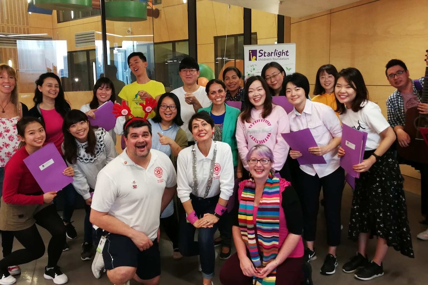 The ICTE-UQ Chorus posing for a photo at  Lady Cilento Children's Hospital