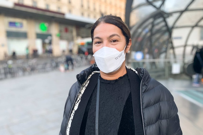 A French commuter in a mask outside a Paris Metro station.