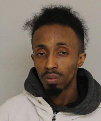 A headshot of Awow, who is wearing a grey jumper