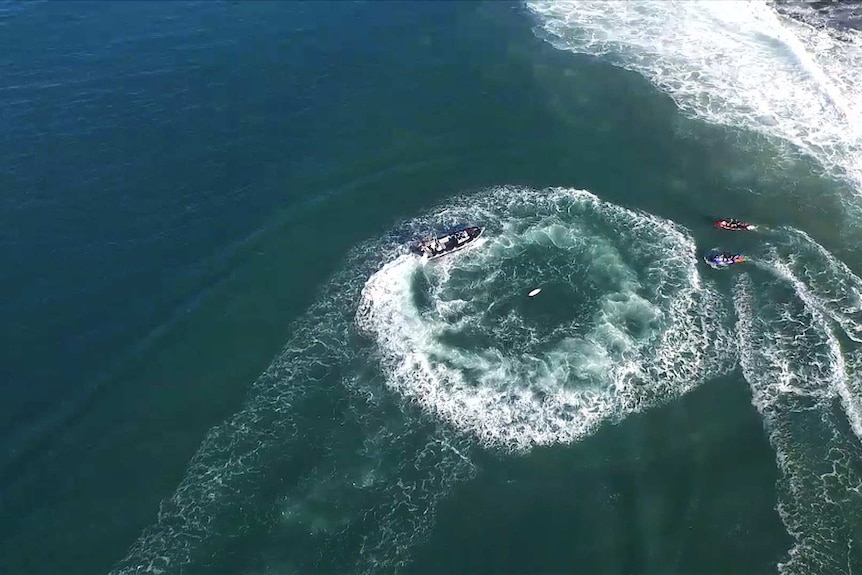 Water safety team circles shark attack area