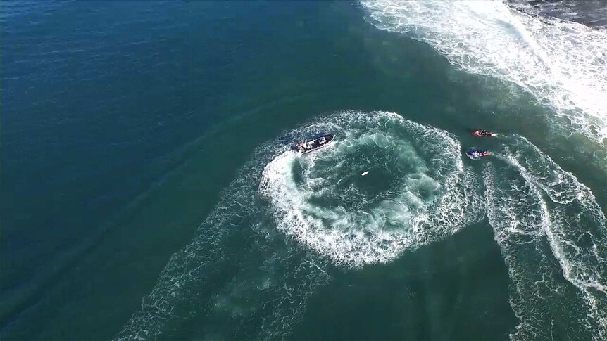 Water safety team circles shark attack area