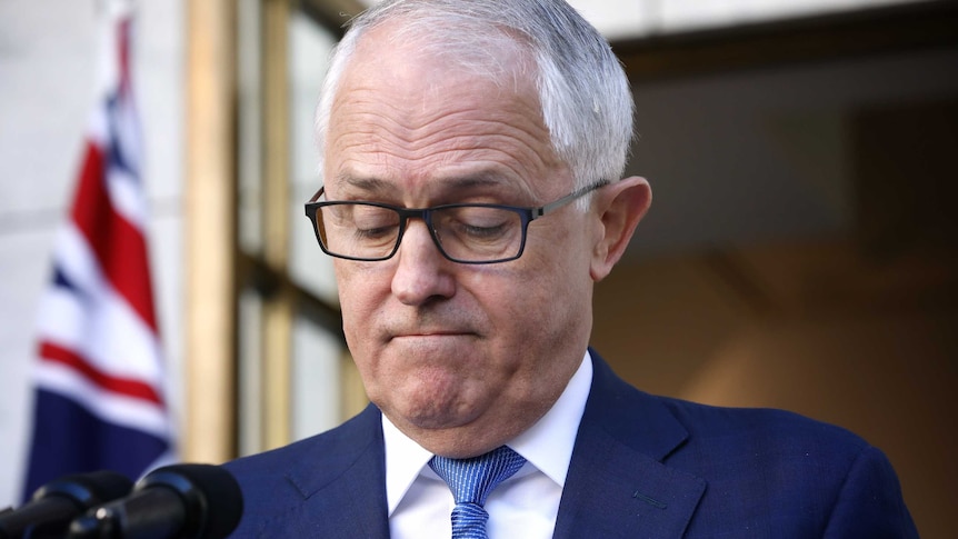 Malcolm Turnbull looking down at press conference in Prime Minister's courtyard