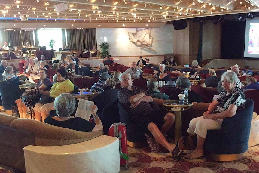 Passengers inside the Sun Princess this morning awaiting to disembark.