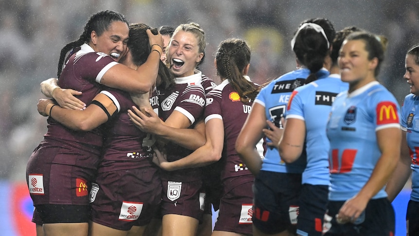Queensland Maroons celebrate a Women's State of Origin try.