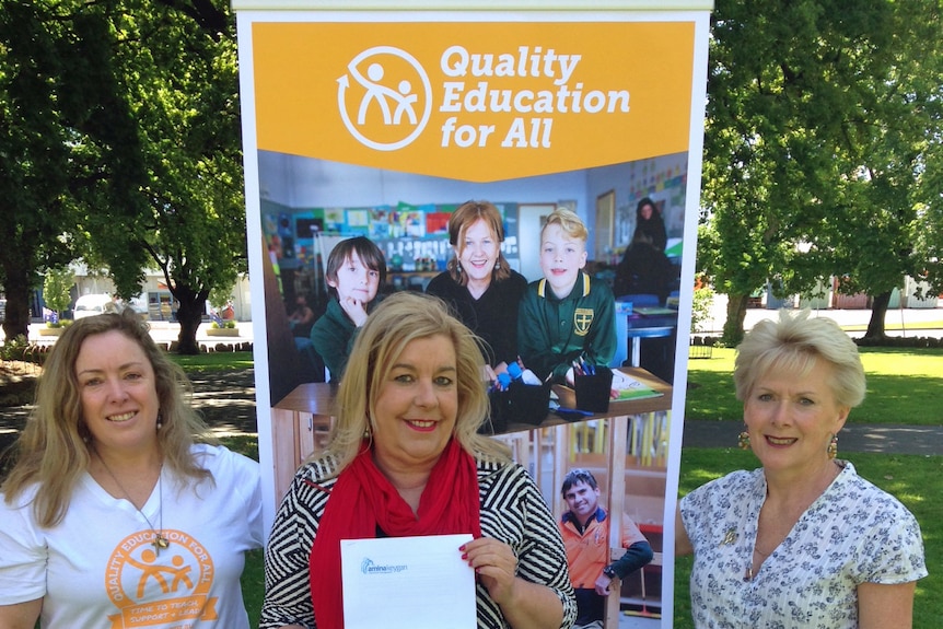 Teachers Marney Wickham (l) and Di Vickers (r) flank AEU President Helen Richardson.