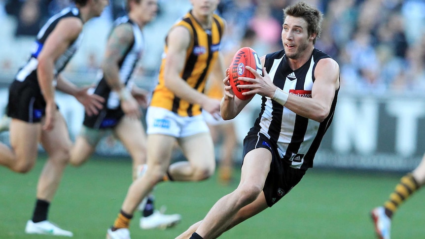 Dale Thomas plays for Collingwood against Hawthorn in July 2012.