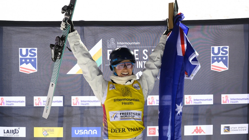 Danielle Scott holds up her skis