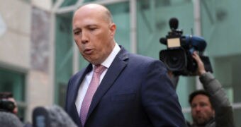 Liberal backbencher Peter Dutton purses his lips at press conference at Parliament House on August 21, 2018.