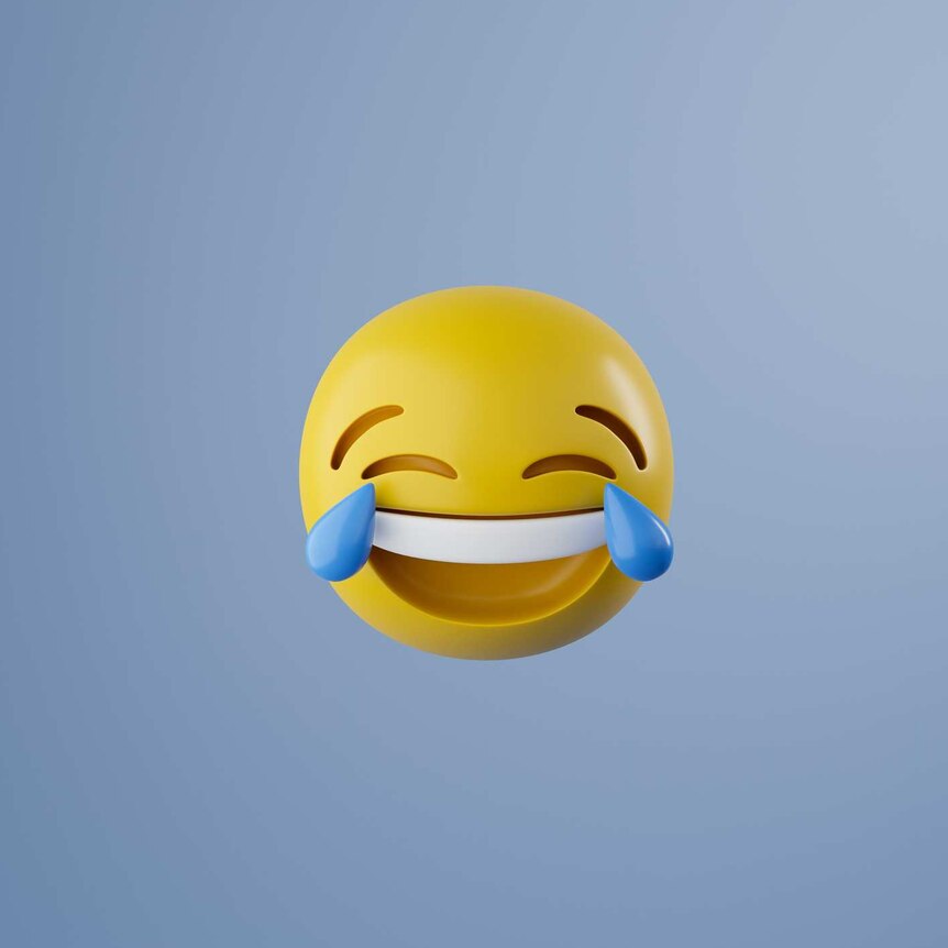 A 3D graphic render of the face with tears of joy emoji -- a yellow sphere with an enormous grin