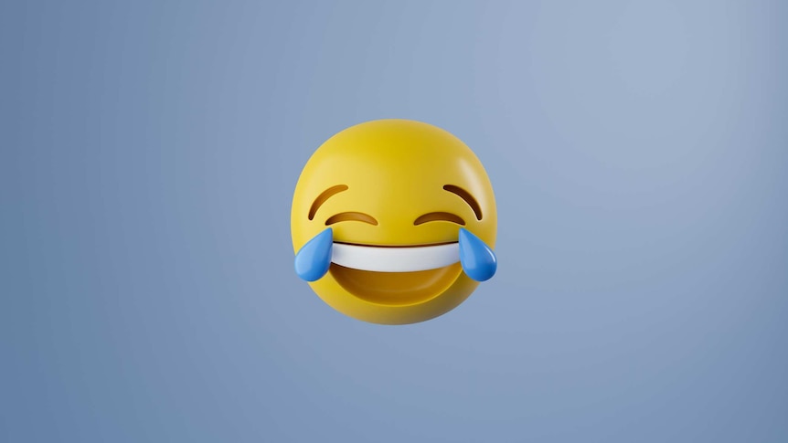 A 3D graphic render of the face with tears of joy emoji -- a yellow sphere with an enormous grin