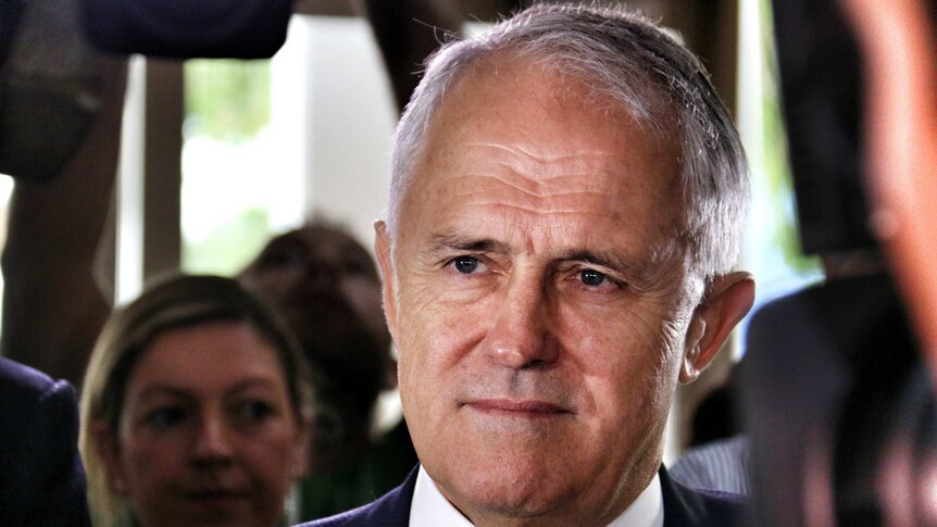 Malcolm Turnbull is pictured surrounded by people.