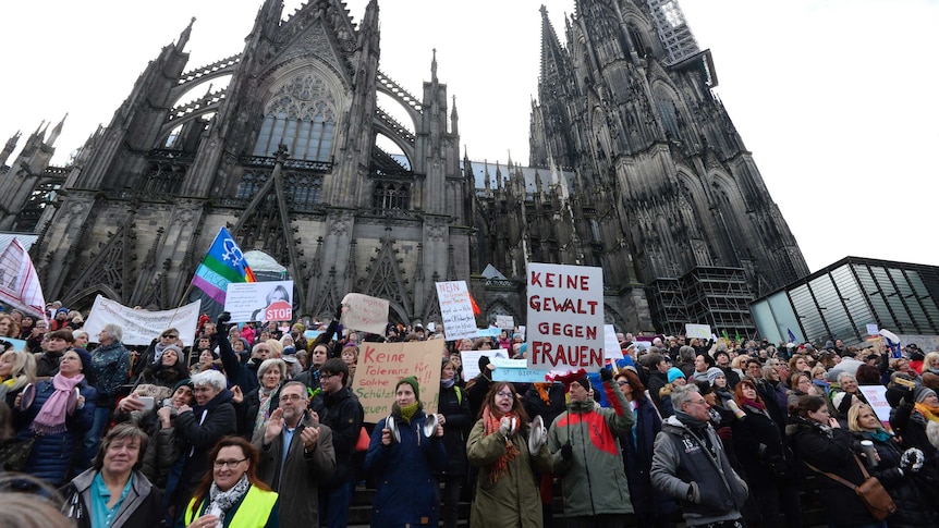 People demonstration against violence against women in front of the Cologne cathedral