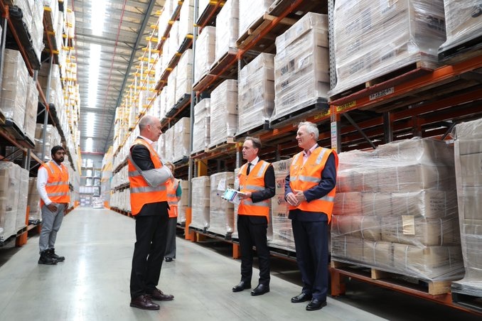 A group of men in a warehouse