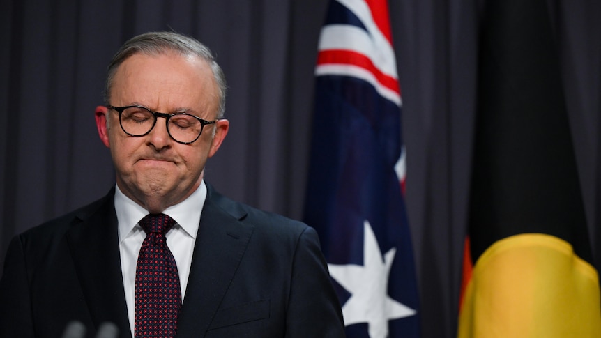 Anthony Albanese frowns during a press conference.