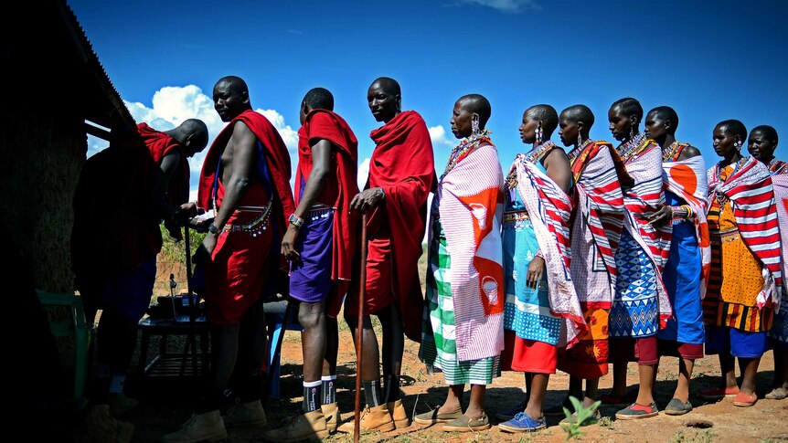 Maasai people queue to register to vote ahead of the March 2013 elections in Kenya.