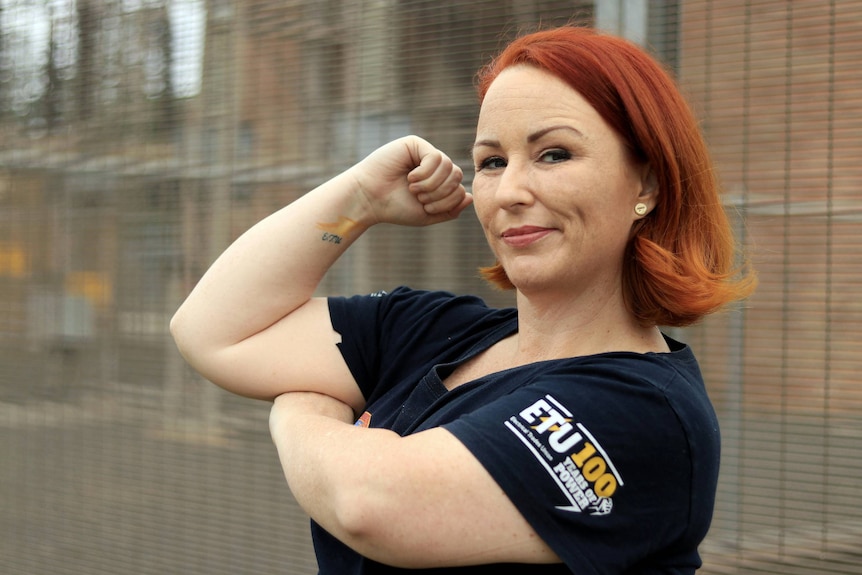 Ellen McNally flexes her muscles.