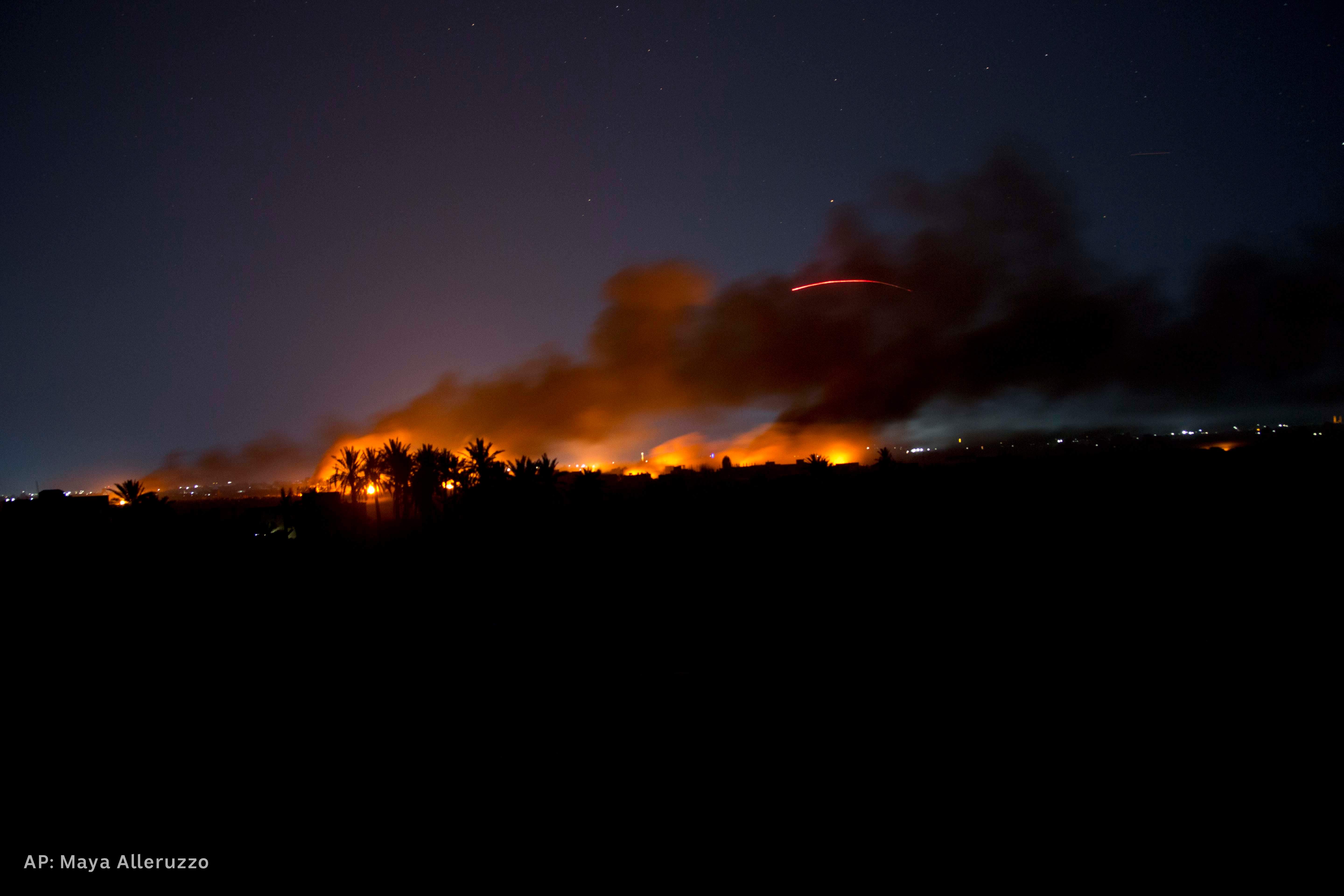 Smoke billows as US-backed Syrian Democratic Forces fire on Islamic State militant positions in Baghouz, Syria, March 11, 2019. 