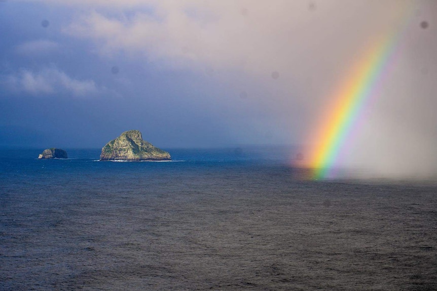 Picture of a rainbow over the ocean