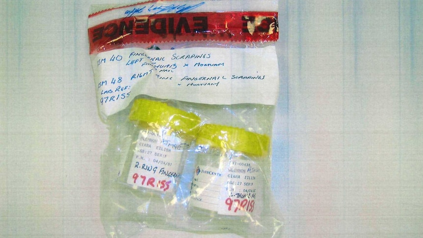 A plastic evidence bag containing two plastic yellow-topped containers.