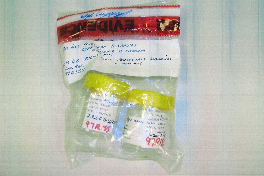 A plastic evidence bag containing two plastic yellow-topped containers.