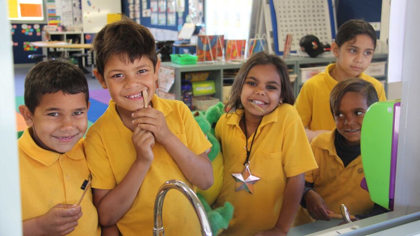 Five children smile at the sink in Boggabilla Primary School