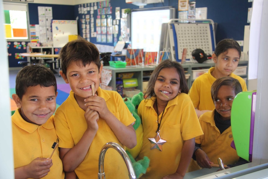 Five children smile at the sink in Boggabilla Primary School