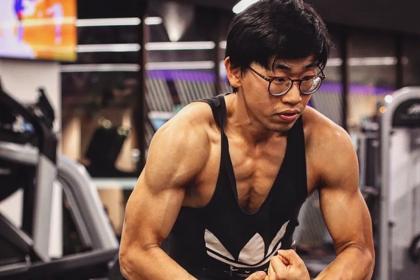 A muscular man at a gym