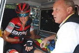 Richie Porte receives medical assistance in an ambulance after abandoning the Tour de France.