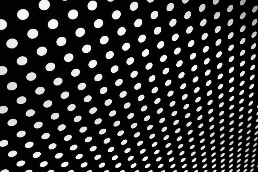 Polka dots on a black background.