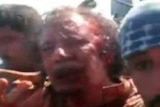 Bloodied Moamar Gaddafi is captured