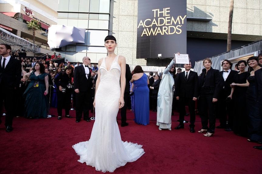 Rooney Mara poses on the red carpet at the Academy Awards.