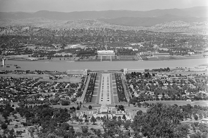 A black and white image of the view of Parliament House from Mount Ainslie in 1970.