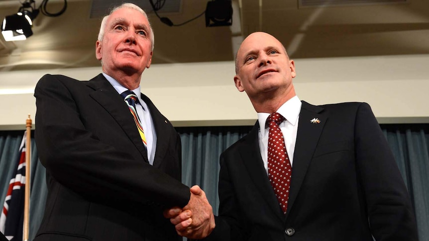 Campbell Newman (right) shakes hands with Richard Chesterman