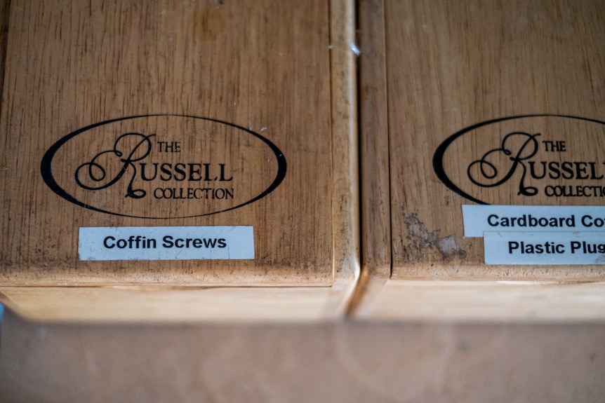 Close up on a box that is labelled "coffin screws'