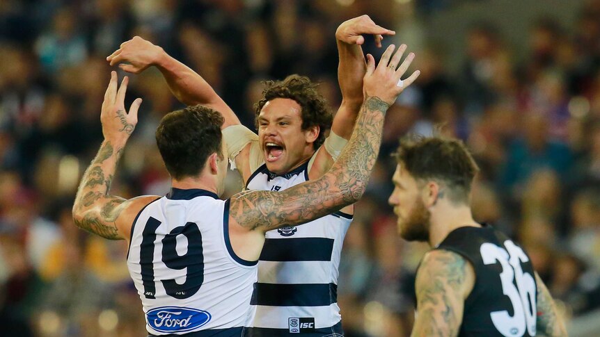 On target ... Steven Motlop (R) celebrates with Mitch Clark after kicking a goal for the Cats