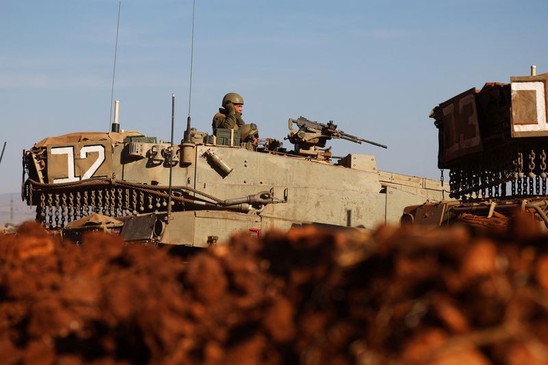 An Israeli soldier is seen in a tank during a military drill near Israel's border with Lebanon